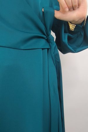 Détail nœud asymétrique robe de soirée bleu vert en viscose